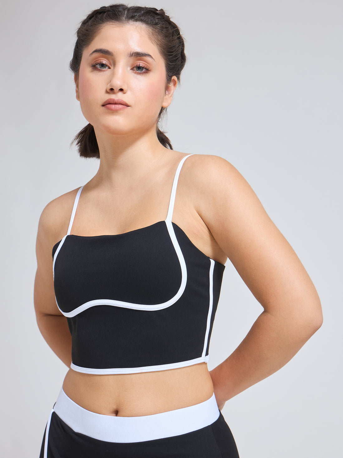 Woman wearing Infinito’s Flexiwear Bra Tank, blending the elegance of a camisole with the structure of a performance bra
