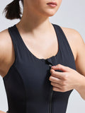 Woman wearing Infinito’s ZipIt Mesh Bra, featuring a front zip closure and longline cut for high-support performance
