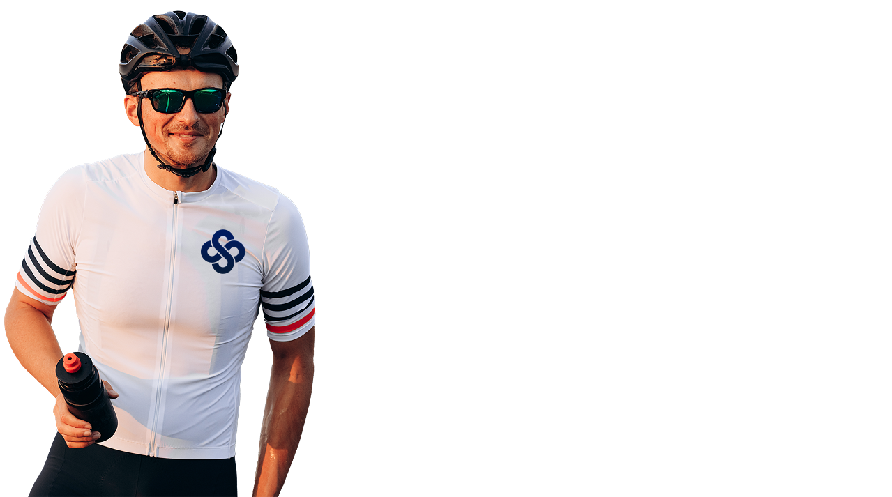 Smiling male cyclist in white performance gear with helmet and sunglasses